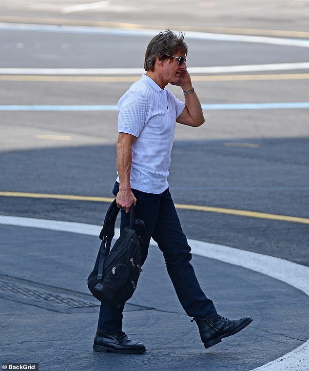 Cruise was seen wearing a stylish white polo shirt with black aviator-style sunglasses and a silver watch.