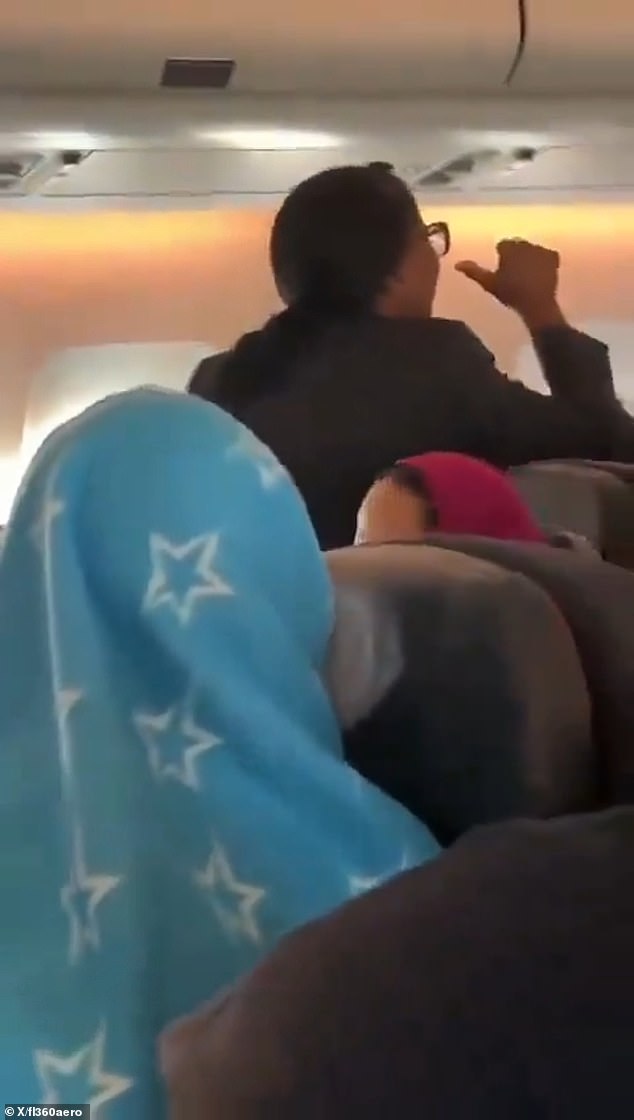 The angry flight attendant was filmed gesturing in French and English towards an unseen passenger on a plane due to fly from Montreal to Casablanca, Morocco.