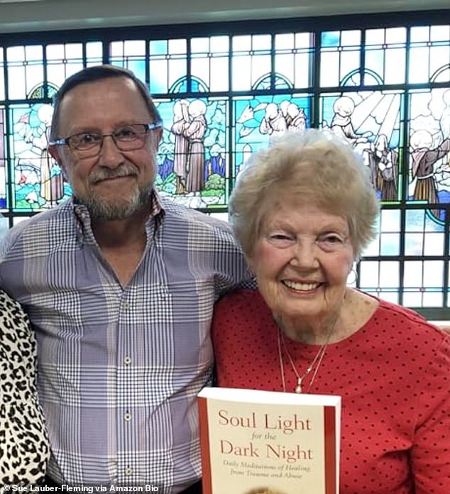 The couple say the illness, from which Fleming has yet to recover, has taken away their joy in life and damaged their marriage. Pictured above, they are holding a book the couple wrote about healing the trauma of past abuse.