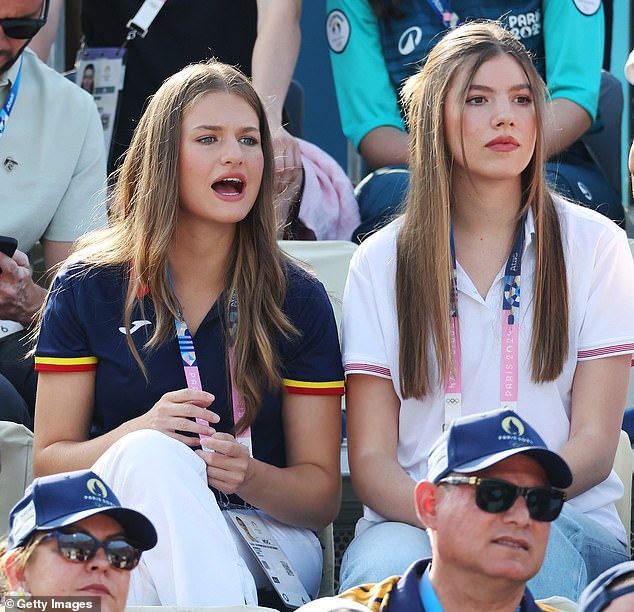 The heir to the Spanish throne (left) was photographed intensely watching the match alongside her sister.