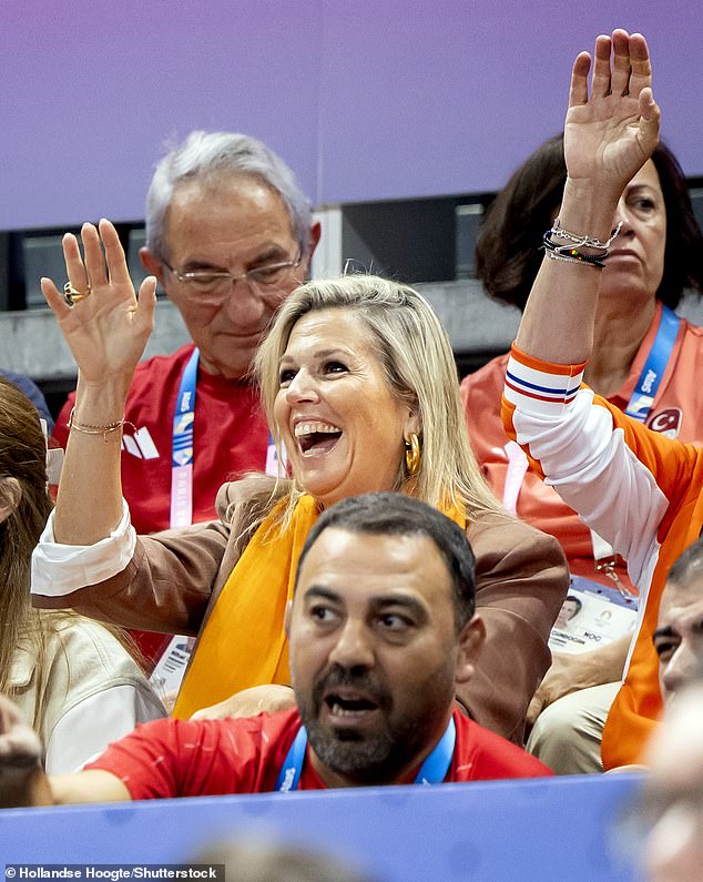 Queen Maxima smiles and waves after watching a women's volleyball match against the Netherlands and Türkiye