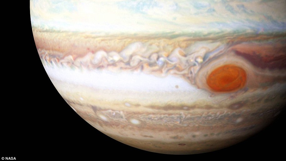 Jupiter's Great Red Spot is a giant oval of crimson-colored clouds in Jupiter's southern hemisphere that run counterclockwise around the perimeter of the oval.