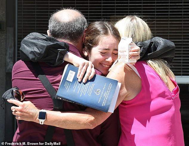 The 26-year-old beamed as she hugged her parents after the brief hearing.