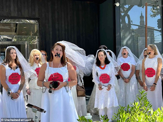 Child marriage survivors are seen protesting with a 'chain', used to represent how children are essentially being imprisoned with these unions, they say.