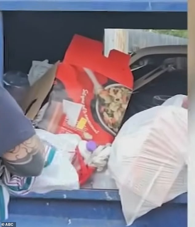 Emergency doctors were then seen wrapping the baby in a blanket next to the dumpster.