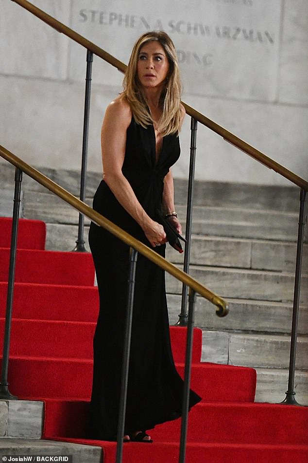 The 55-year-old actress was spotted in a stunning low-cut black dress outside the New York Public Library in New York City on Monday night.