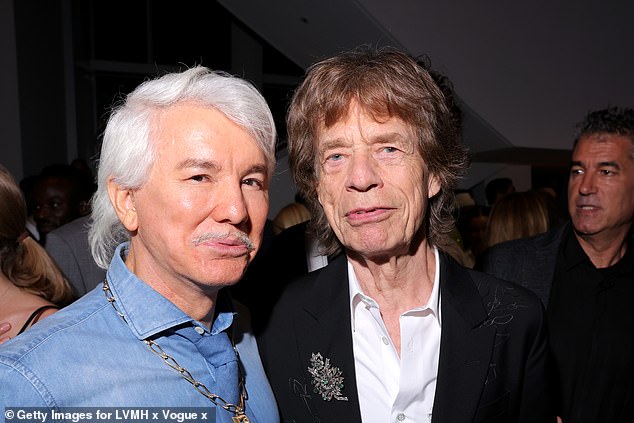 Baz's unusual look was the subject of much comment from fans. He was photographed with Mick Jagger at the event.