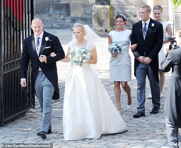 The bride and groom photographed after the ceremony, followed by maid of honour Dolly Maude and best man Iain Balshaw.