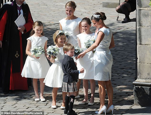 The bridal party pictured gathered outside at Canongate Kirk