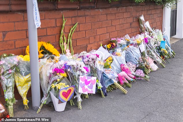 Floral tributes near the scene of the incident in Southport today after two children were killed and nine injured