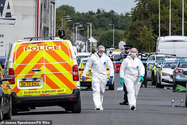 Forensic officers in Southport, Merseyside, yesterday after the horrific stabbing incident