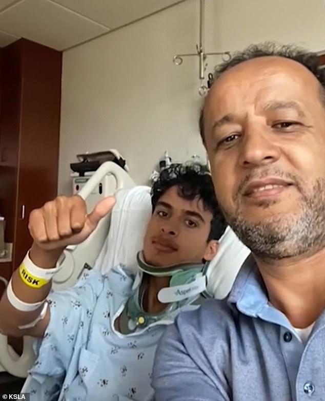 Bounagui gives a thumbs up from his hospital bed with his father smiling at his side.