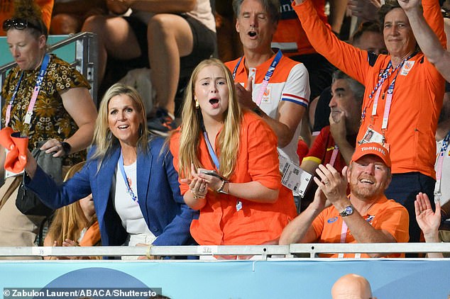 The Queen lifted her Dutch national team cap to cheer on her home team. Her daughter, Catharina-Amalia (middle), looked overjoyed as she clapped and cheered. Meanwhile, middle daughter Alexia applauded from her seat.