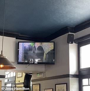 A live feed from the Morpeth Arms cells is shown on a television next to the bar (pictured)