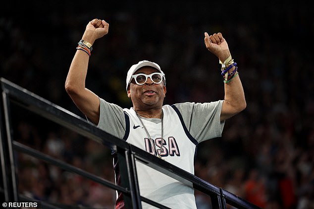 Film director Spike Lee wore a white USA T-shirt along with a matching cap and dark sweatpants.