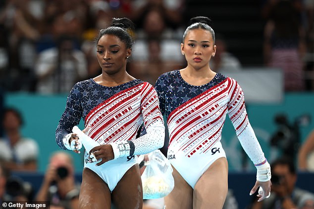 Team USA's Simone Biles and Sunisa Lee look on during Tuesday's action in Paris