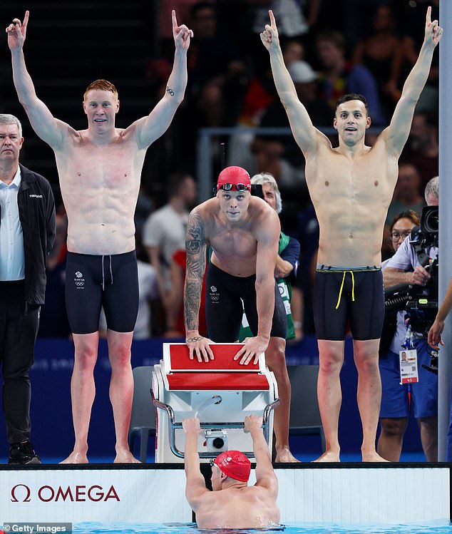 The champions pose poolside as Tom Dean (left), Matthew Richards (centre), James Guy (right) and Duncan Scott (in pool) enjoy a dominant victory