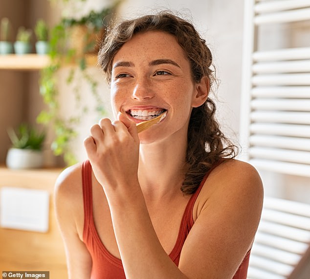 As for toothpaste, the dental hygienist said she prefers one that contains fluoride, which can help protect teeth from cavities (file image)