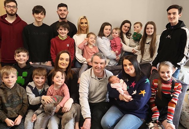 Noel, 53, and Sue, 49, have had 22 children together over the past 34 years. The couple are pictured with 19 of their children at their home in Morecambe following the birth of their daughter Heidie in April 2020.