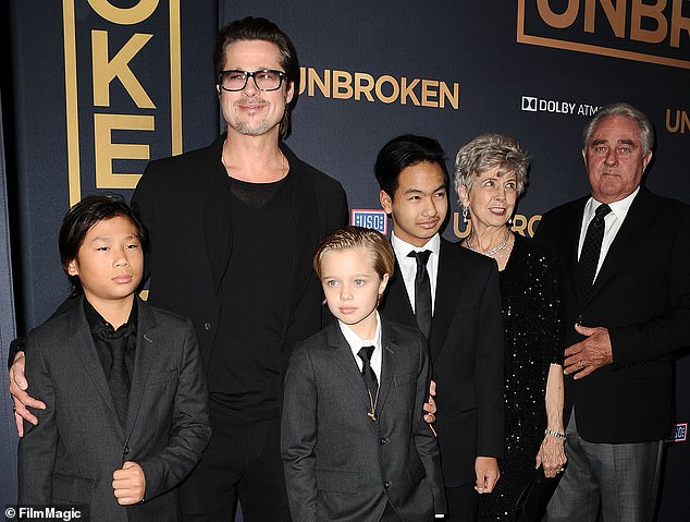 In addition to Pax, she and ex Brad share five other children: Maddox, 22; Zahara, 19 (not pictured); Shiloh, 18; and twins Knox and Vivienne, 16 (not pictured); Pax, Shiloh and Maddox are seen with Brad and his parents in 2014 in Hollywood.