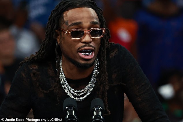 Harris made a reference to the rapper's 2018 Migos hit, 'Walk It, Talk It,' Quavo is seen here at the event