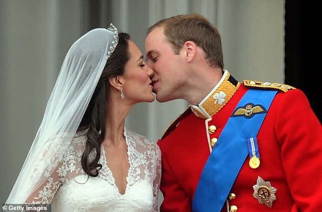 Prince William and Kate kiss on the balcony of Buckingham Palace after their wedding, April 29, 2011