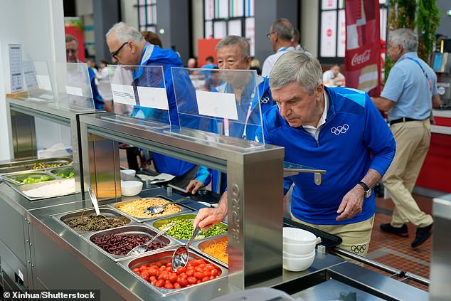 The salad options in the Olympic Village have not been a hit with all athletes in Paris (pictured, IOC President Thomas Bach samples the food)