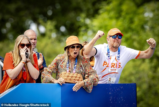 Queen Máxima (left) of the Netherlands was pictured looking cheerful and upbeat as she watched the Netherlands team on the second day of the Paris Olympics.