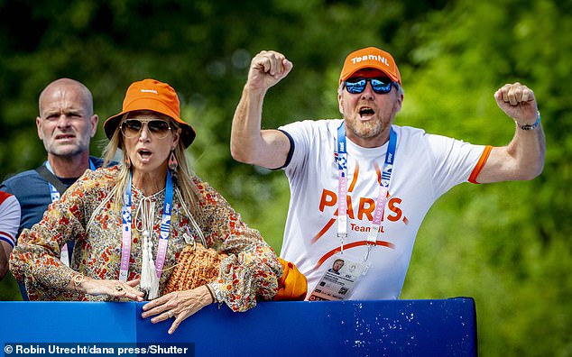 The pair looked very happy as they watched the race. Their runner, Dutchman Pieterse Puck, came in fourth place with a time of 1:29:25.