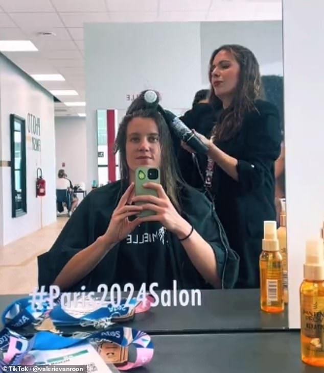 Dutch swimmer Valerie Vanroon washed, cut and styled her hair during her trip.