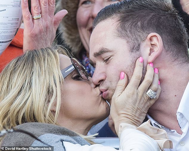 The former glamour model currently has a warrant out for her arrest after she skipped a scheduled £760,000 bankruptcy court hearing on Tuesday (pictured with ex Kieran Hayler)