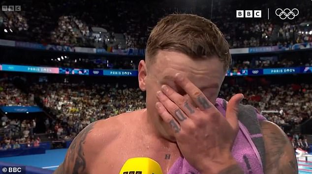 An emotional Adam broke down in tears during a television interview before heading into the stands to hug his loved ones.