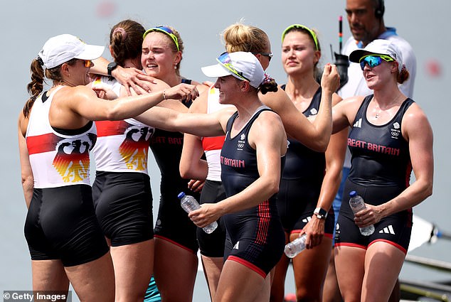 The triumphant British team is congratulated by bronze medallists Germany.