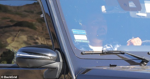 Paul was in the driver's seat of Britney's Mercedes G500 SUV after their meal, with Britney in the passenger seat.