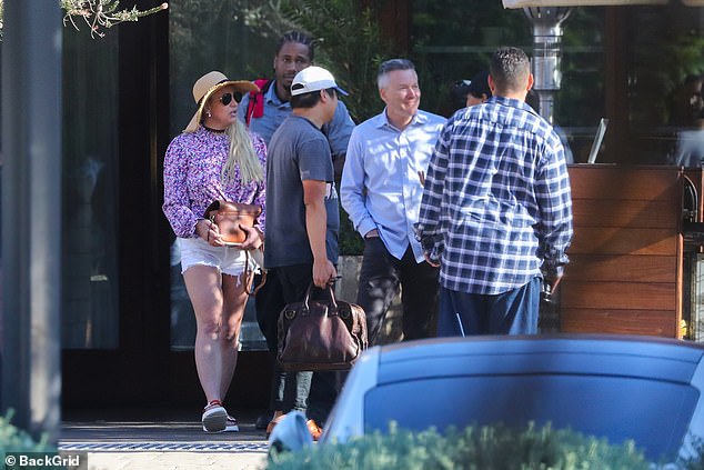 Britney was seen with Paul and several others, but it's unclear if they were a large group.