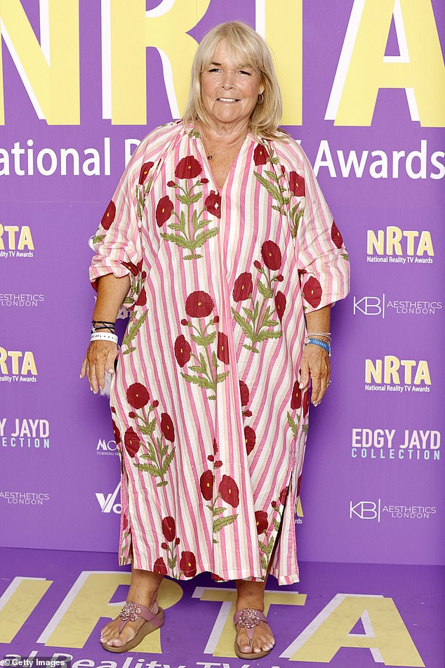 Linda Robson adopted a summery look with a pink and white dress with red flowers.