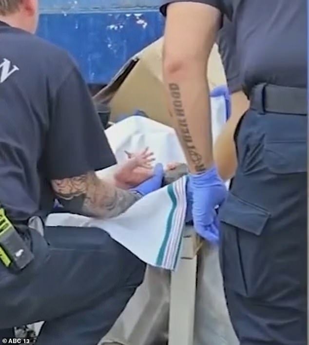 Heartbreaking footage shows officers responding to the scene outside a Houston apartment building and finding the baby inside a bag.