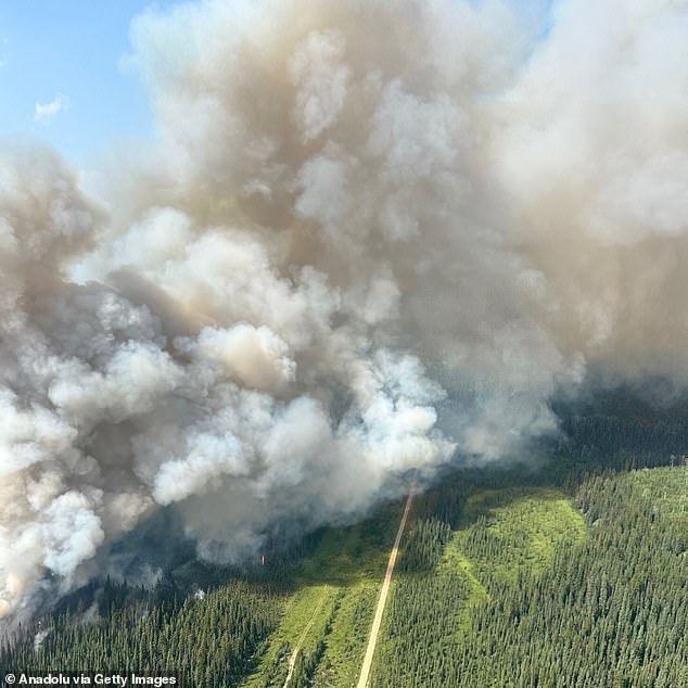 An aerial photograph shows smoke from wildfires rising over Jasper National Park, Alberta, Canada, on July 24, 2024.