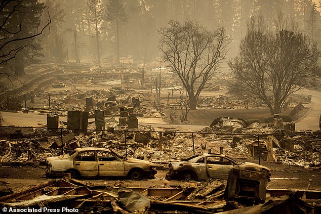 The move signals financial trouble for the insurance giant, which currently covers homes razed by wildfires. Homes razed by the Camp Fire line a development on Edgewood Lane in Paradise, California, in 2018.