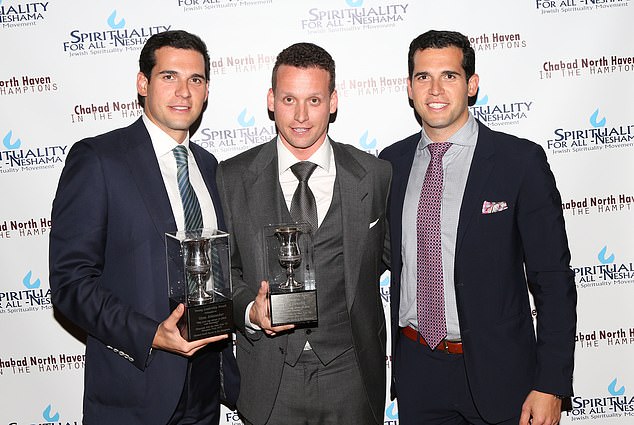 Oren and Alon (pictured with Tal, center) have since been accused of rape by 30 more women after two alleged victims filed an initial complaint this month.