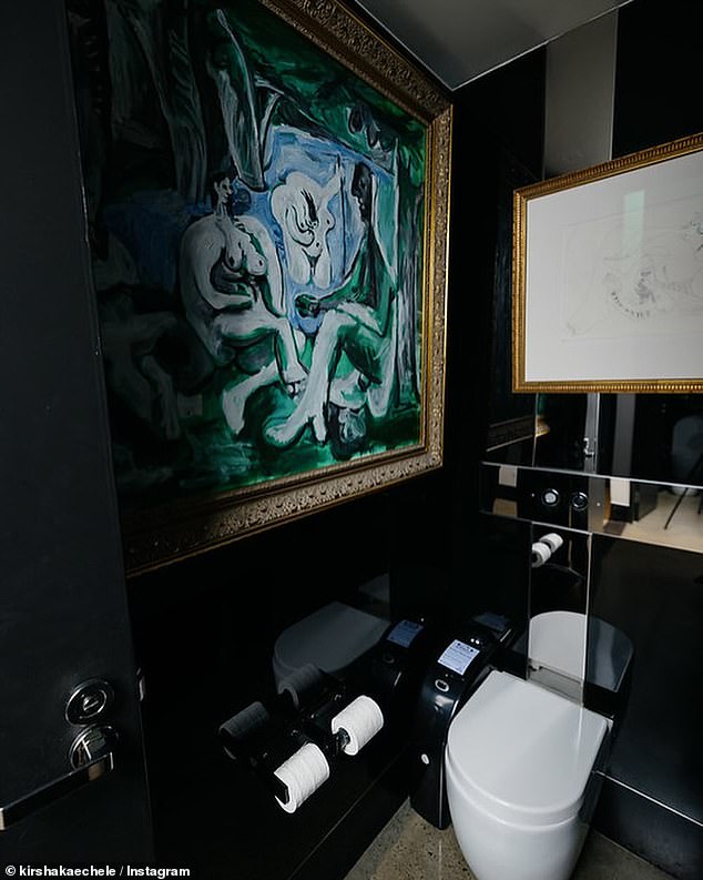 The fake Picassos were moved inside a bathroom stall.