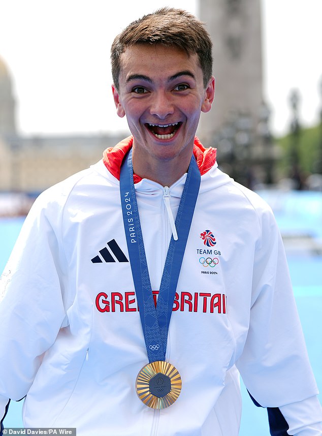 Alex is pictured with his gold medal after the men's individual triathlon on the Pont Alexandre III on day five of the Paris 2024 Olympic Games in France.