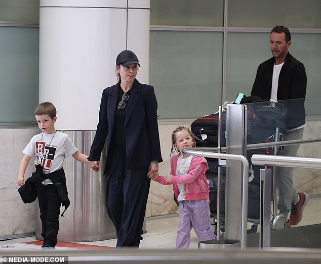 Allison, 45, appeared unfazed by the allegations as she strolled through Sydney Airport on Friday with husband Michael Willesee Jr. and their two children: son Mack, 7, and daughter Scout, 4.