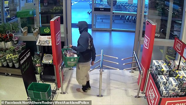 The police officer saw the man, who was wearing a hoodie and a pair of shorts, as he left through the wrong exit of the store (pictured).