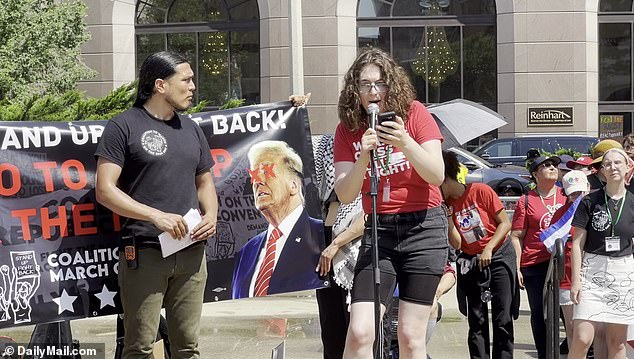 An event speaker offers remarks on LGBTQ rights advocacy