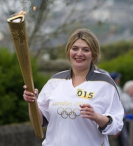 Bryony Gordon with the Olympic torch during her leg of the London 2012 torch relay