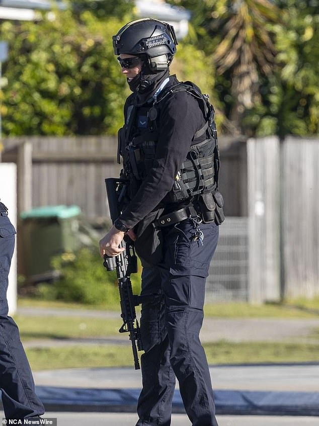 A police tactical team was on the scene and the woman was released unharmed after a tense standoff.