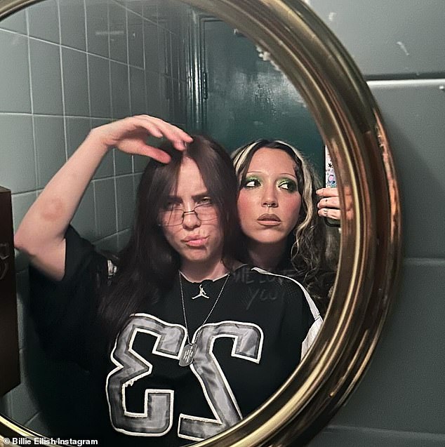 In another snapshot, she posed with a friend in front of a mirror.