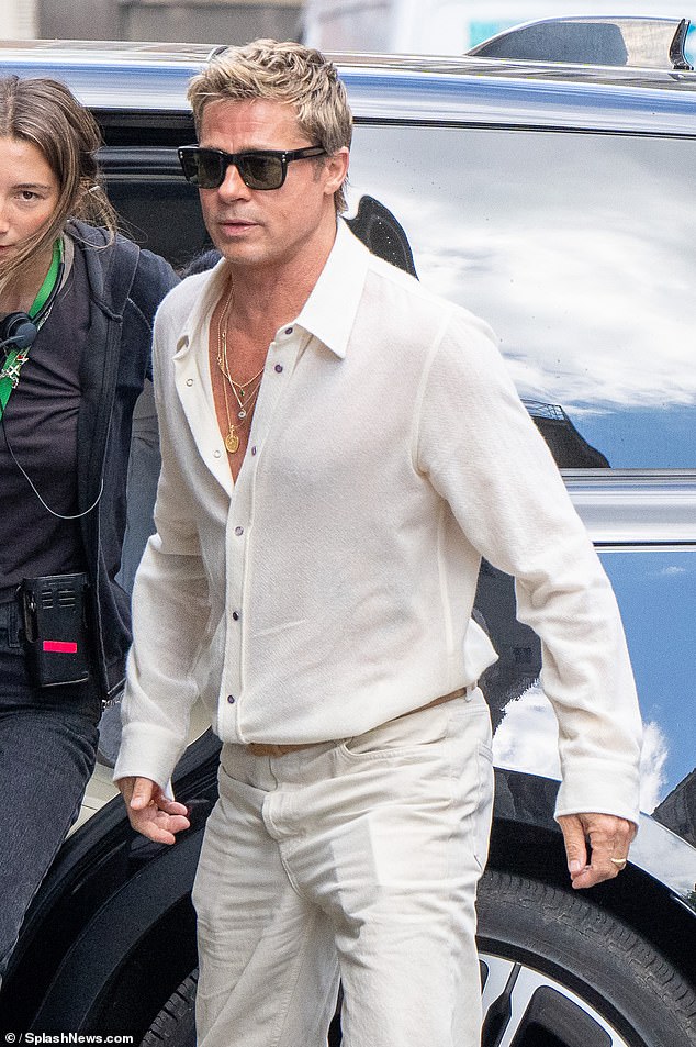 The 60-year-old Fight Club star sported a cream-coloured shirt that was slightly unbuttoned, revealing his chest.