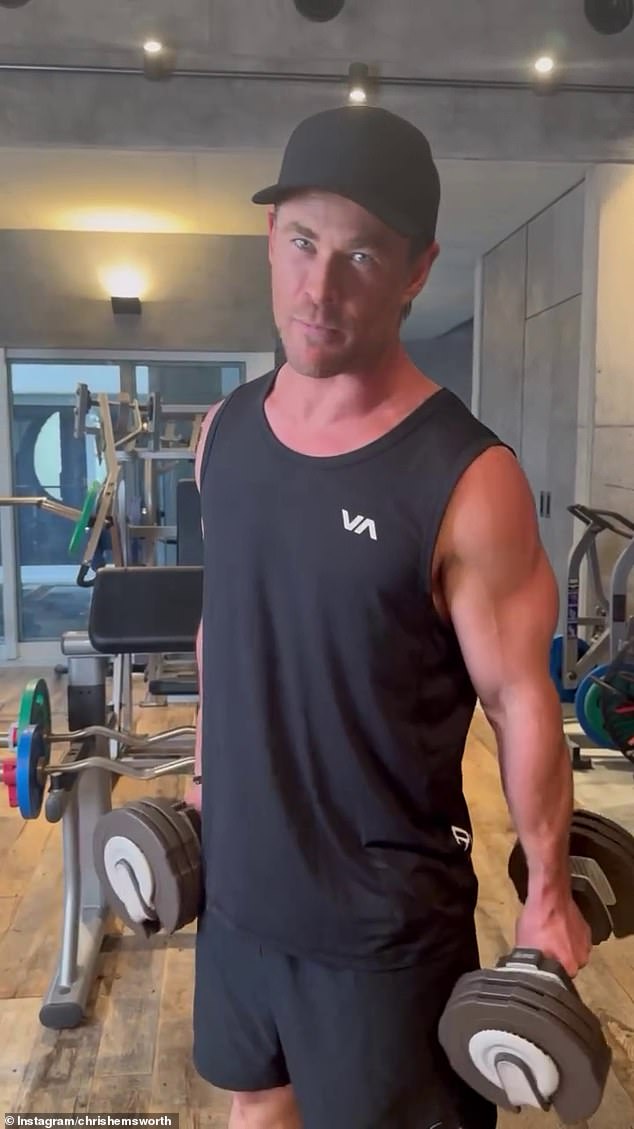 Barely breaking a sweat in the video, Chris, 40, flaunted his sharp guns in a black RCVA tank top, black workout shorts and a simple black baseball cap as he completed his formidable workout.